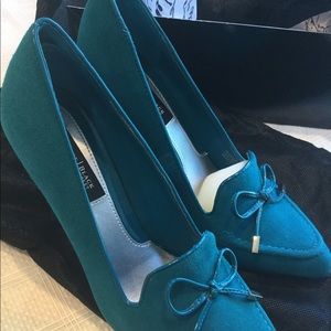 Teal suede pumps.